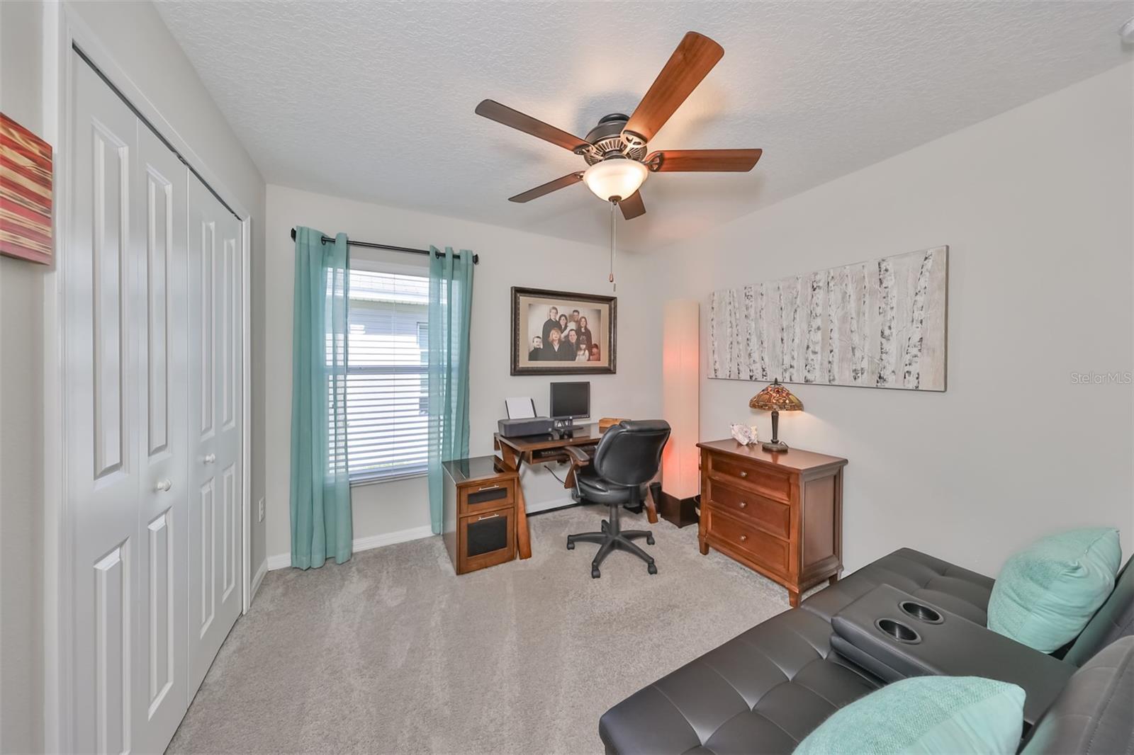 Fourth bedroom is bright and spacious, also with a large wall closet.