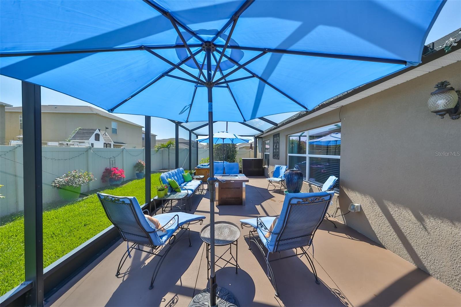 An oasis in your backyard!!  Beautiful screened lanai that covers the entire back of the house.