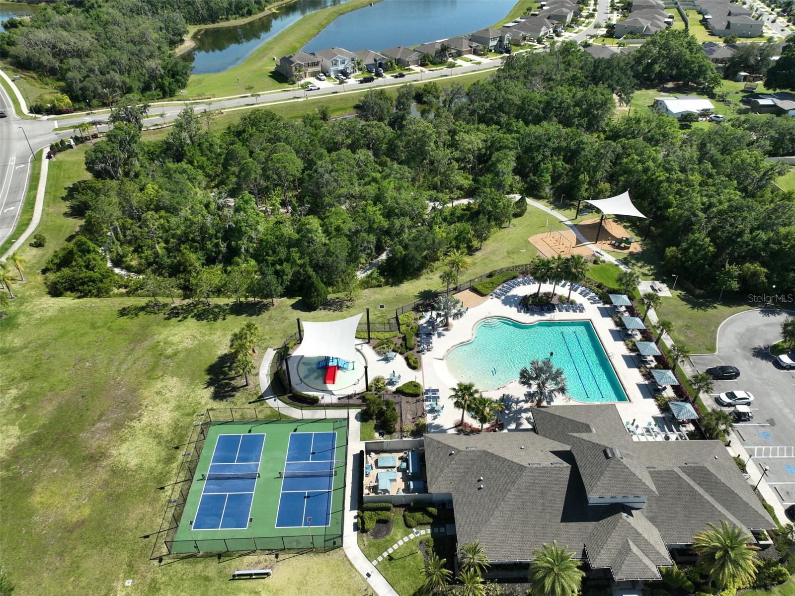 Club house, tennis courts, pool, splash pad, playground and fitness center.