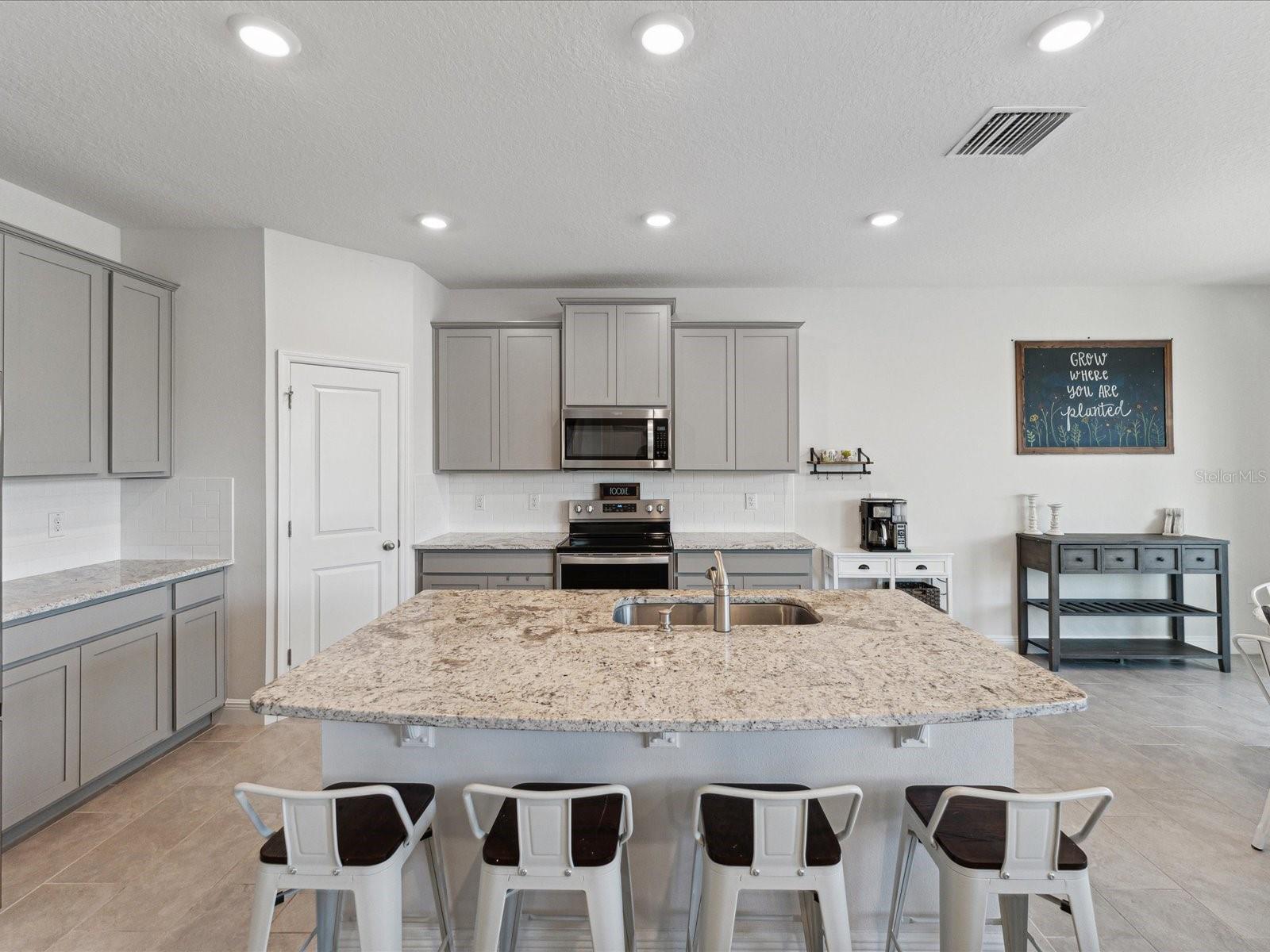 The kitchen island has space to serve and eat for easy entertaining.