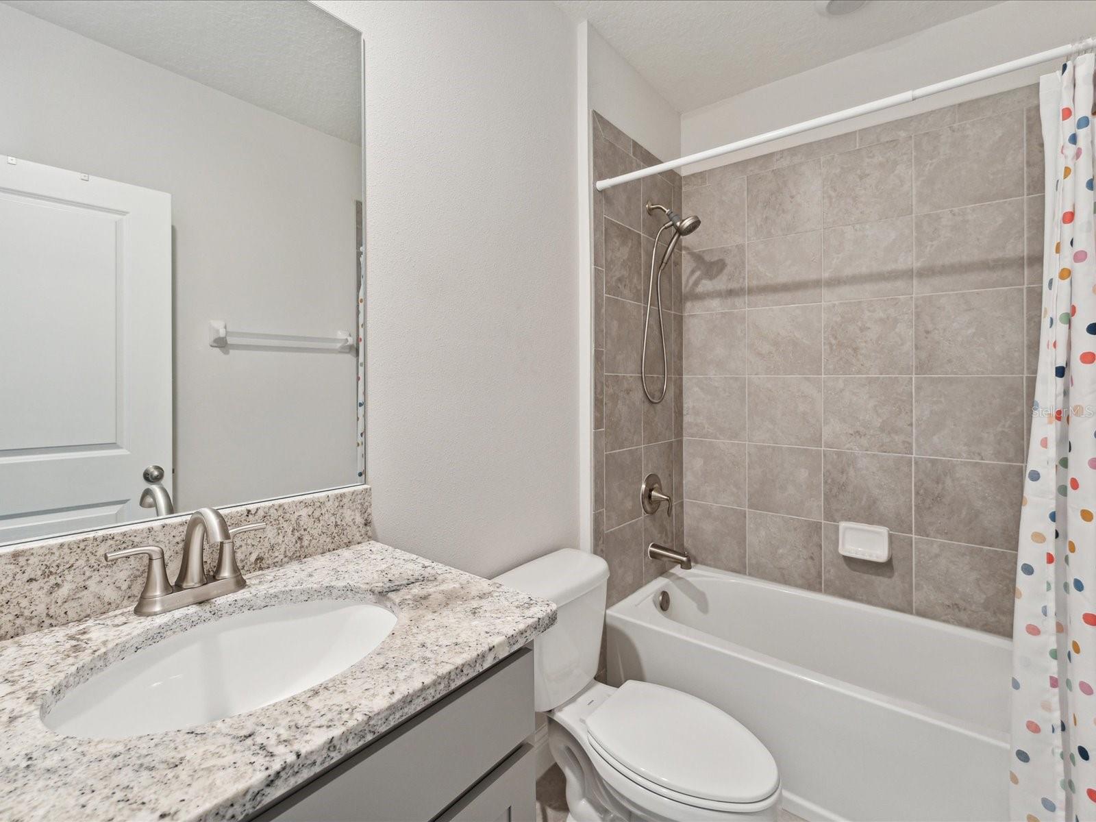 The 2nd full bathroom is used by the 2nd and 3rd bedroom and is left of the staircase.
