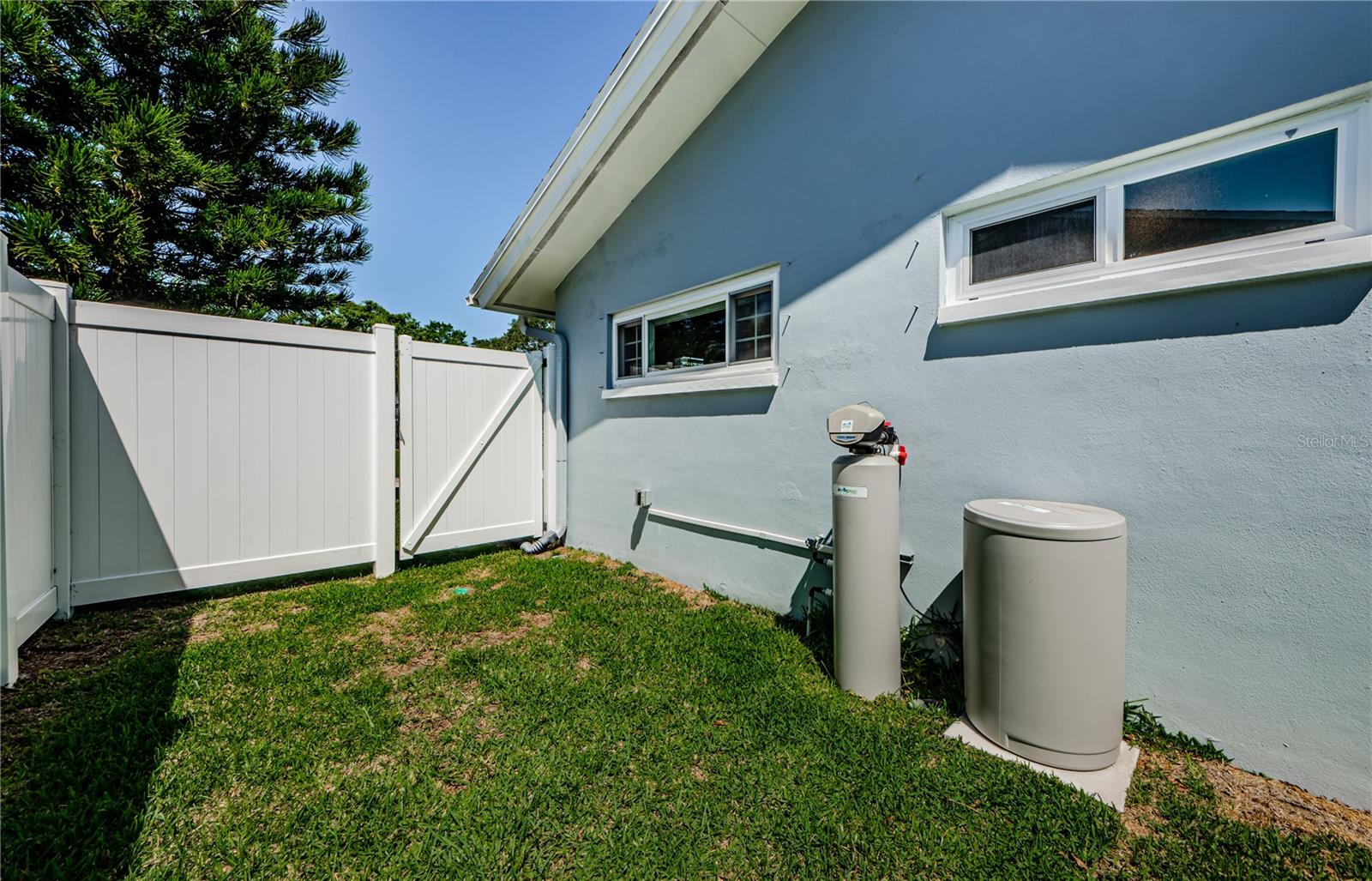 Side yard and picture of water softener