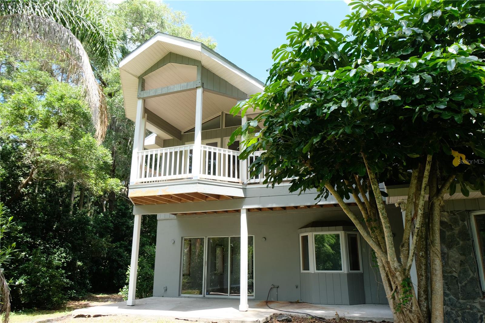 upstairs master balcony and downstairs patio