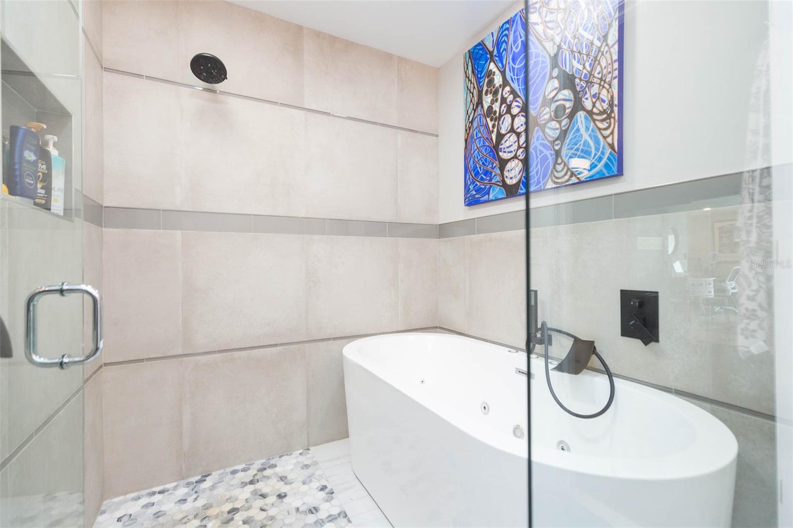 Primary ensuite has been fully renovated and includes shower with large jacuzzi tub.
