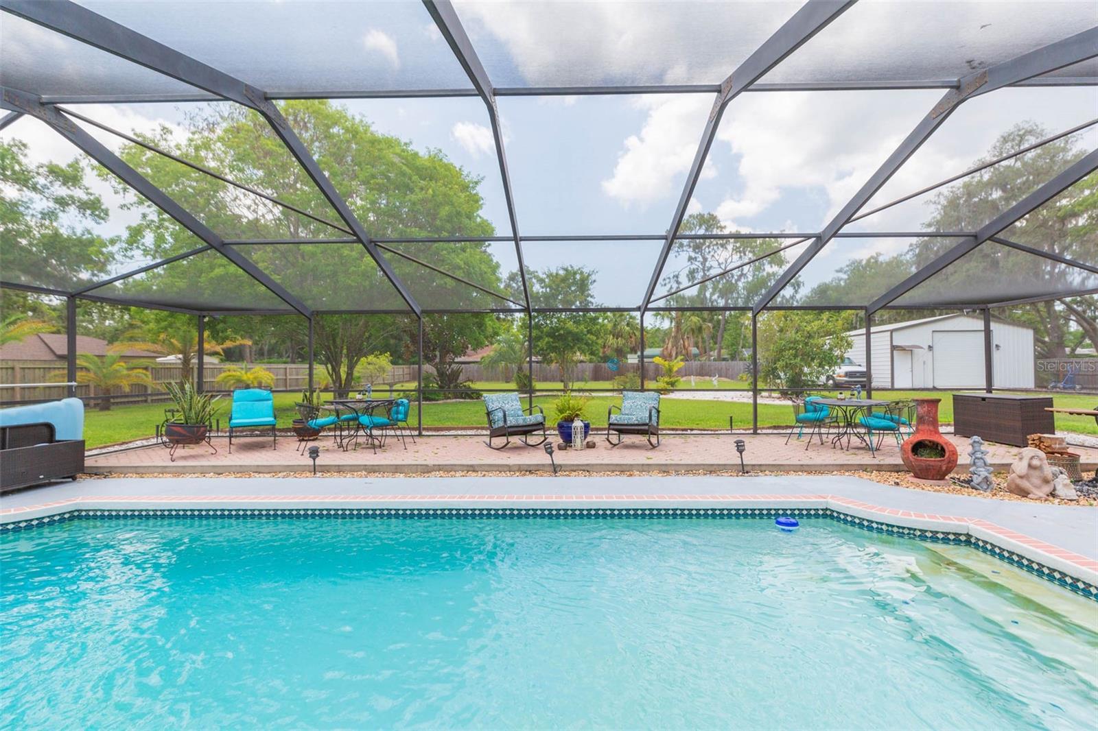 Pool is enclosed, inviting; a great place to entertain...