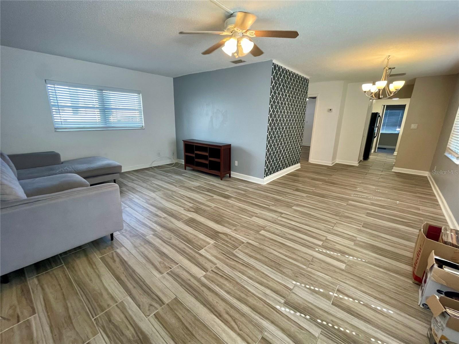 Living room, ceramic tile/wood look flooring throughout the home