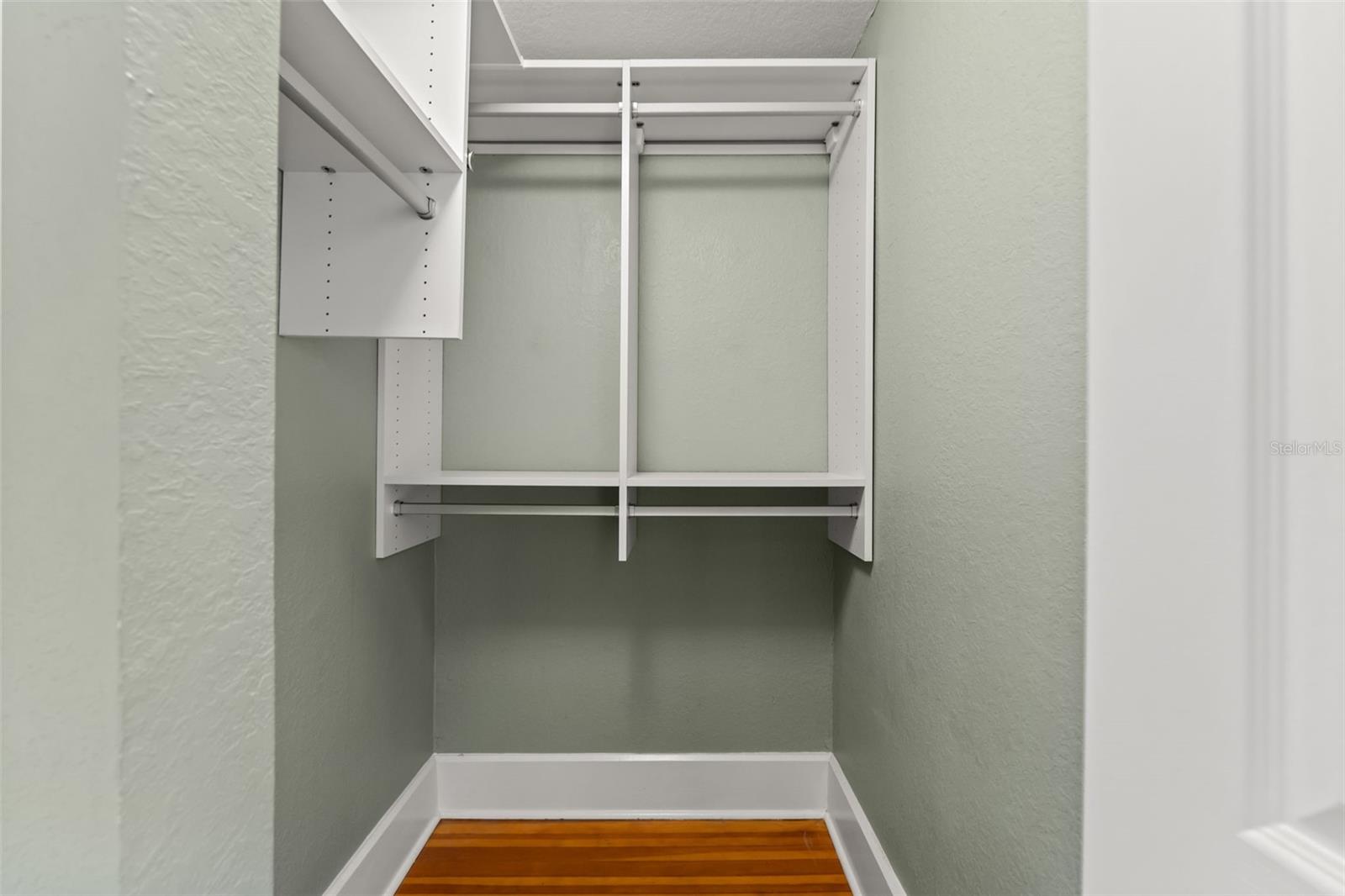secondary bedroom with walk-in closet