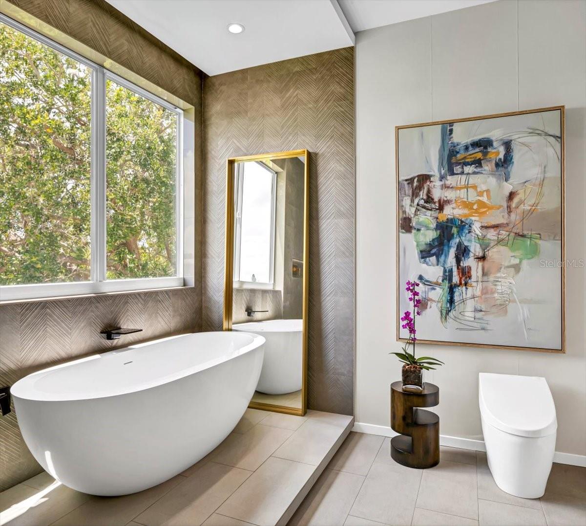 Pamper yourself in the marvelous oval soaking tub, resting upon a dedicated platform.