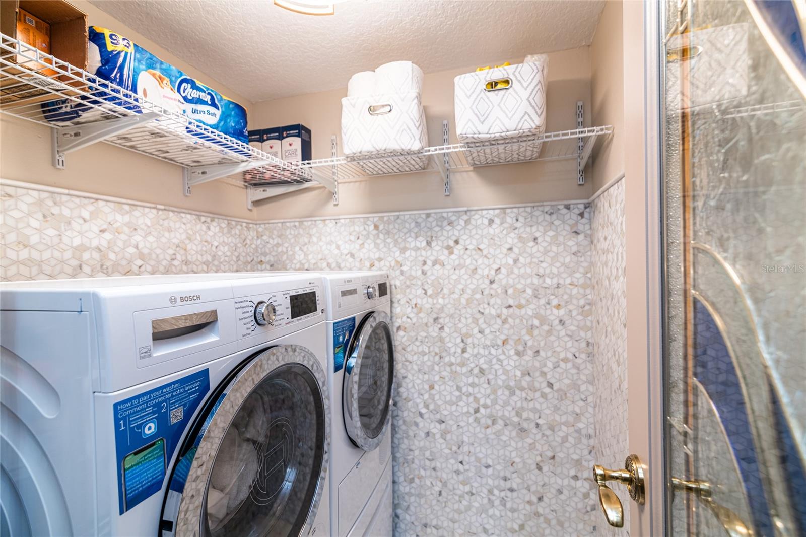 Even the laundry room has new appliances and custom tile work.