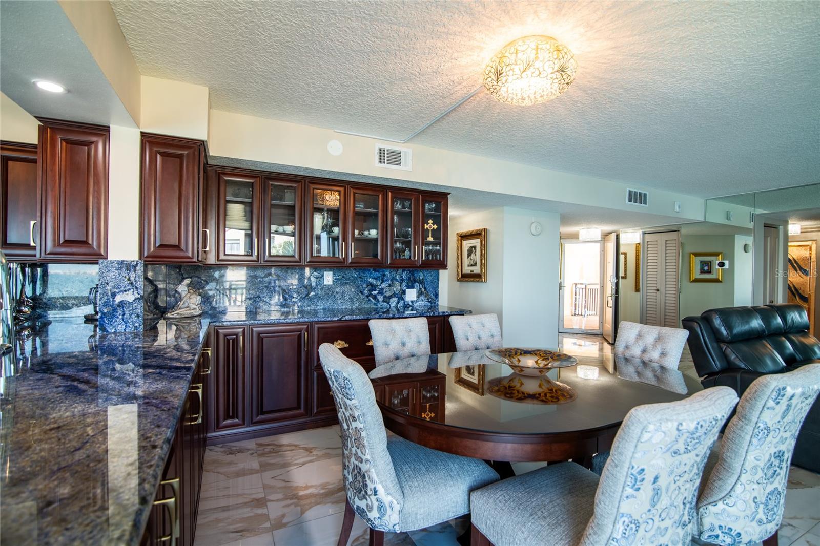 Extra cabinets and counter space make this dining area perfect for entertaining.