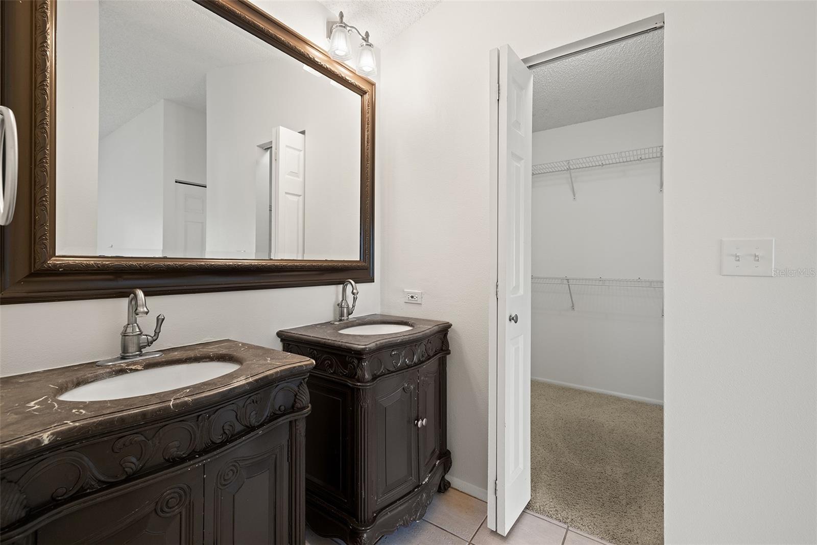 Master Bath with double sinks and walk-in closet