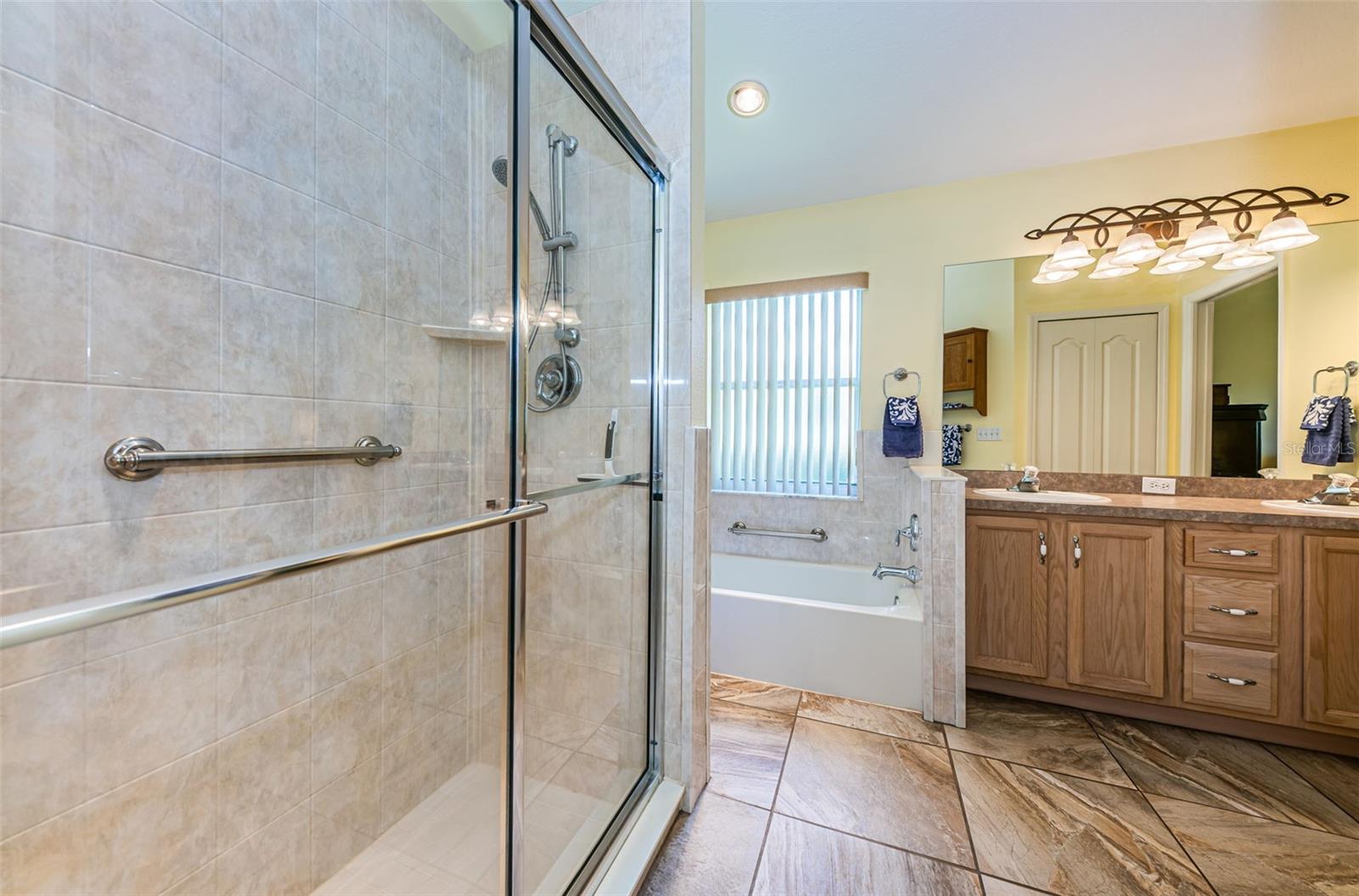 Master bathroom with walk-in shower and separate tub