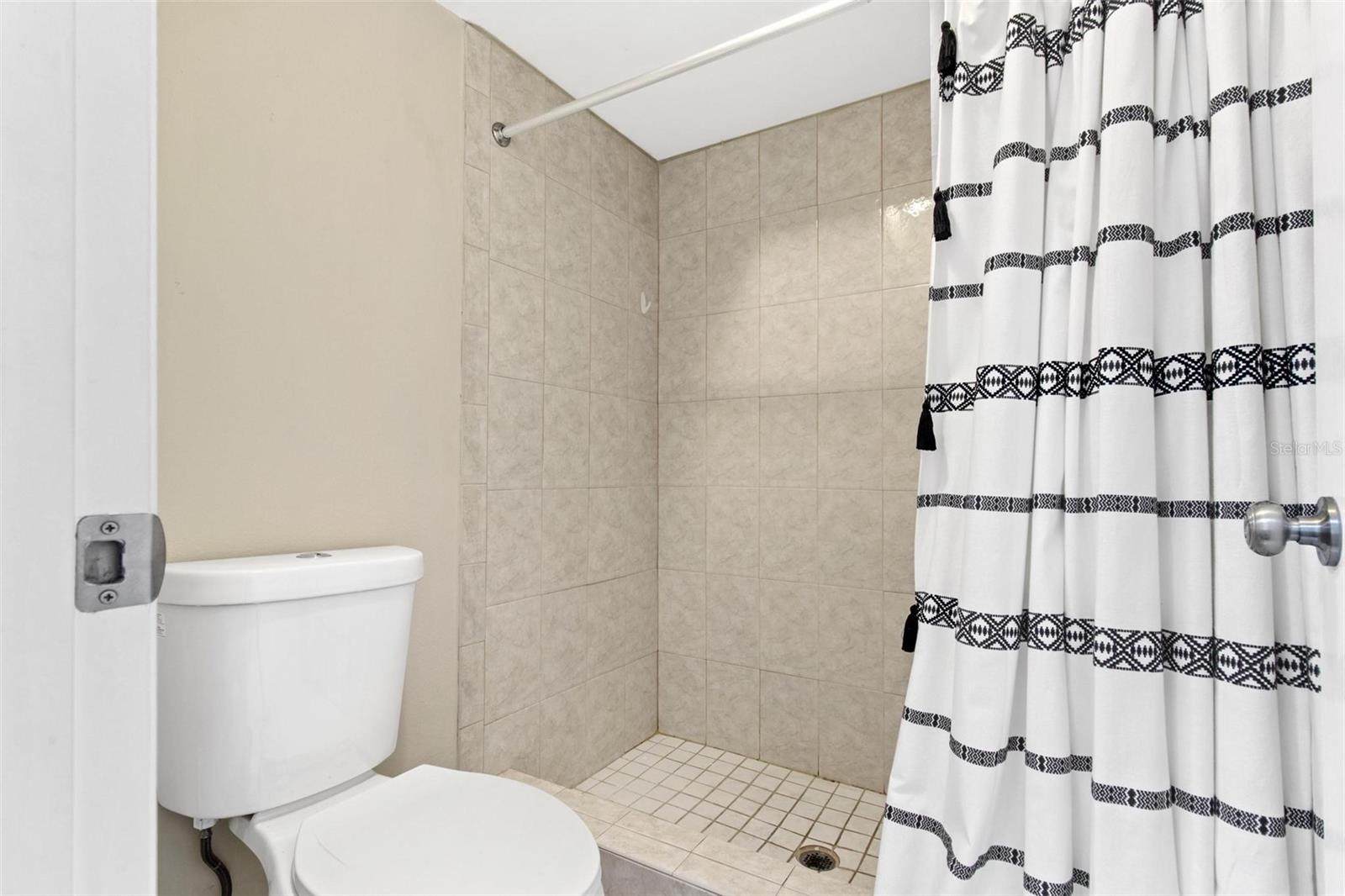 Separate primary comode and shower area en suite
