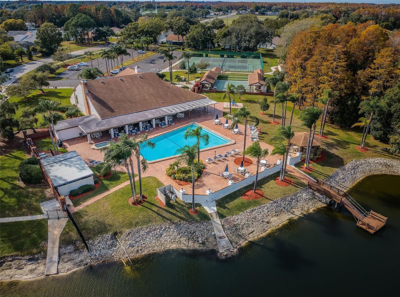 Community pool , clubhouse and amenities  , aerial view.