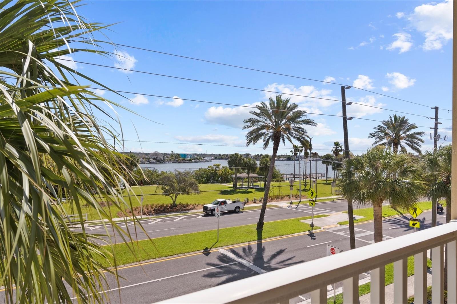 2nd Floor Eastern Balcony from Master Bedroom. Another fantastic spot for morning coffee.  Photo does not do justice of view in person. Crosswalk in photo offers easy access to water font park where you can exercise, kayak, paddleboard or fish.