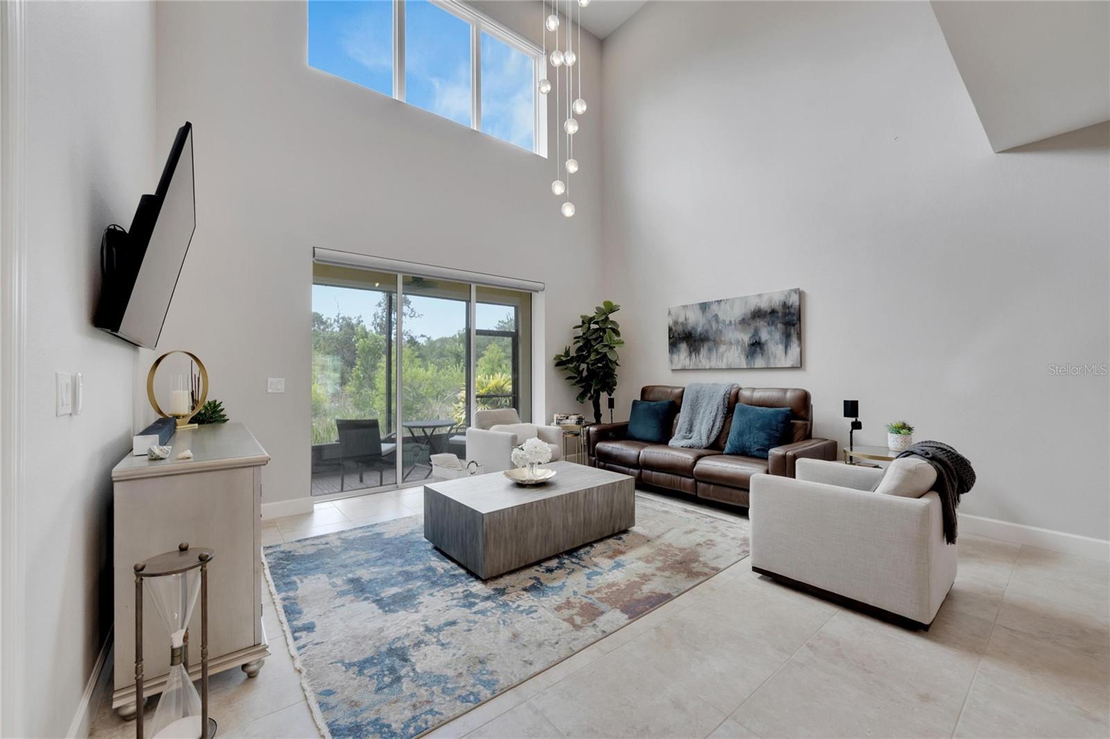 Living room with great conservation views at 12306 Terracina Chase Ct, Tampa, FL 33625