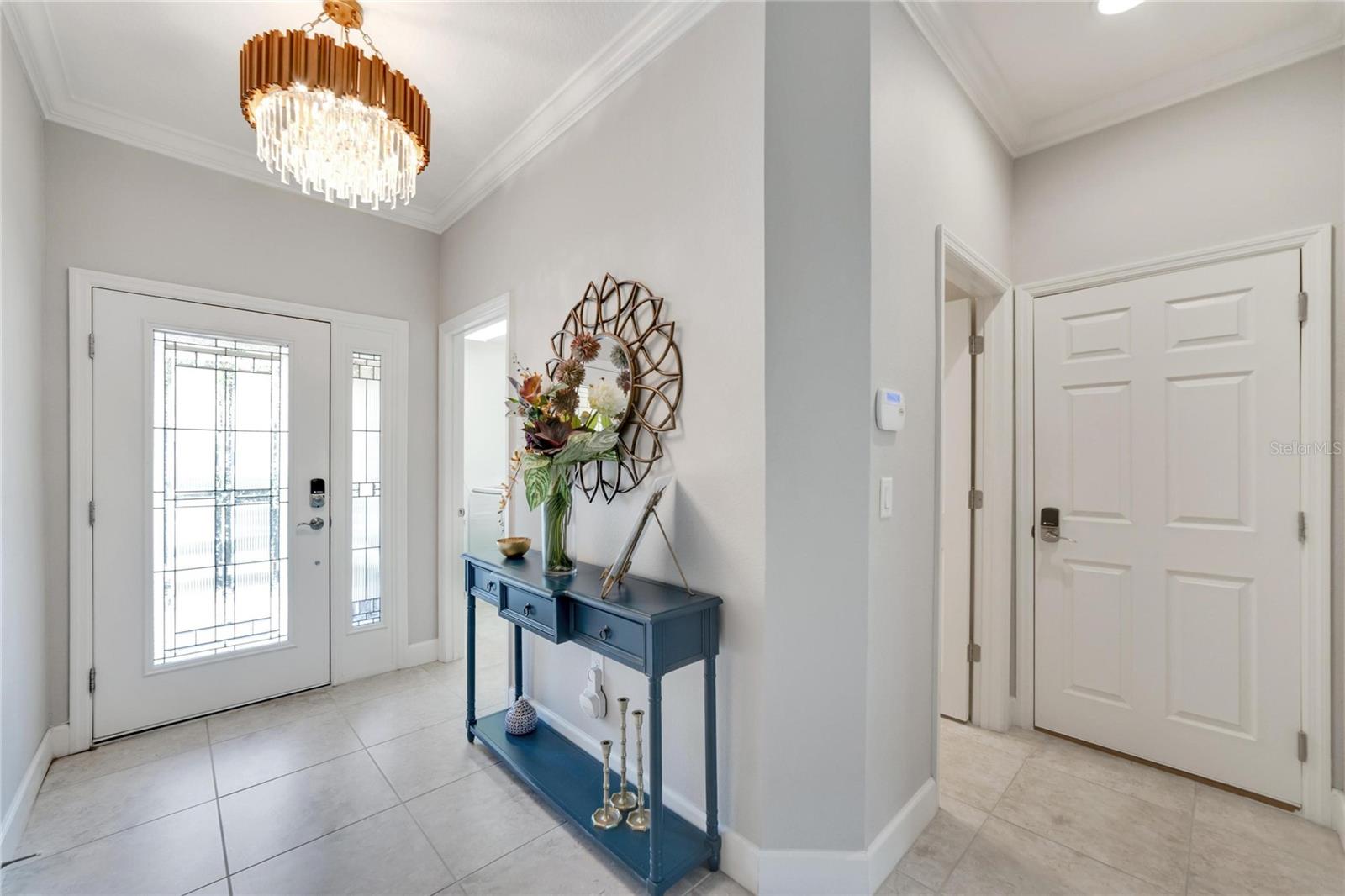 Entry with custom chandelier at 12306 Terracina Chase Ct, Tampa, FL 33625