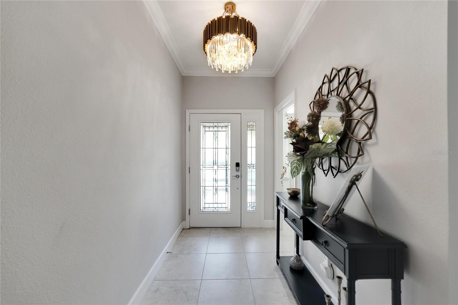 Entry with custom chandelier at 12306 Terracina Chase Ct, Tampa, FL 33625
