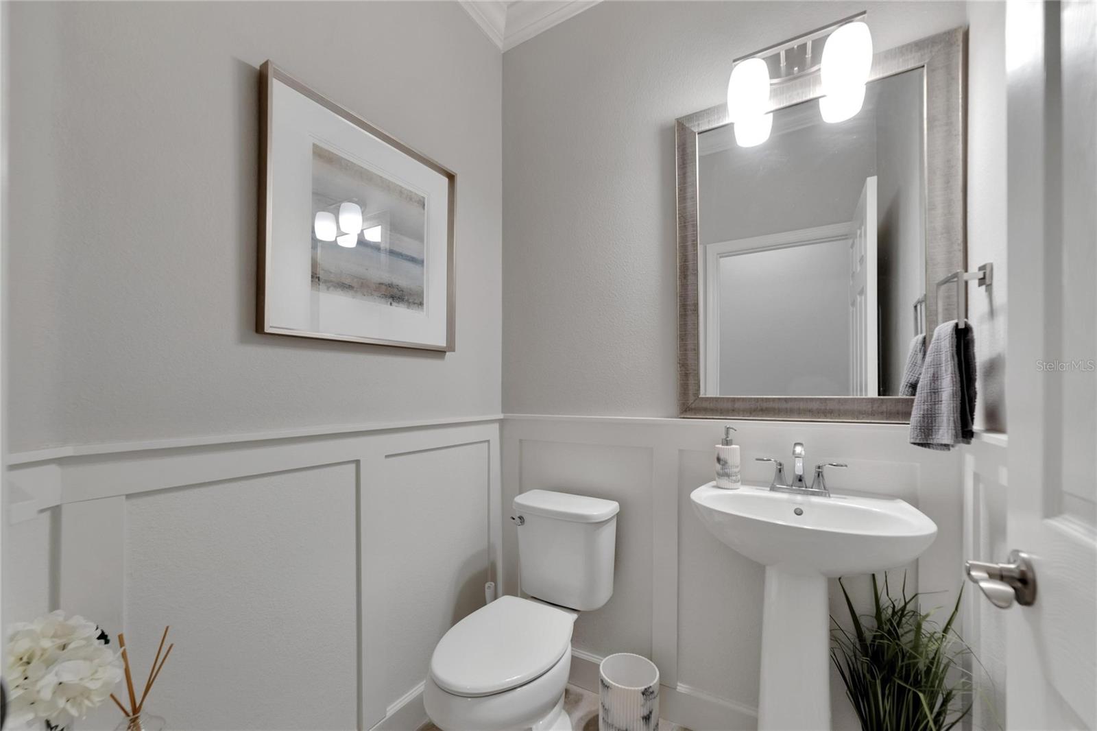 Guest bath with custom wainscoting at 12306 Terracina Chase Ct, Tampa, FL 33625