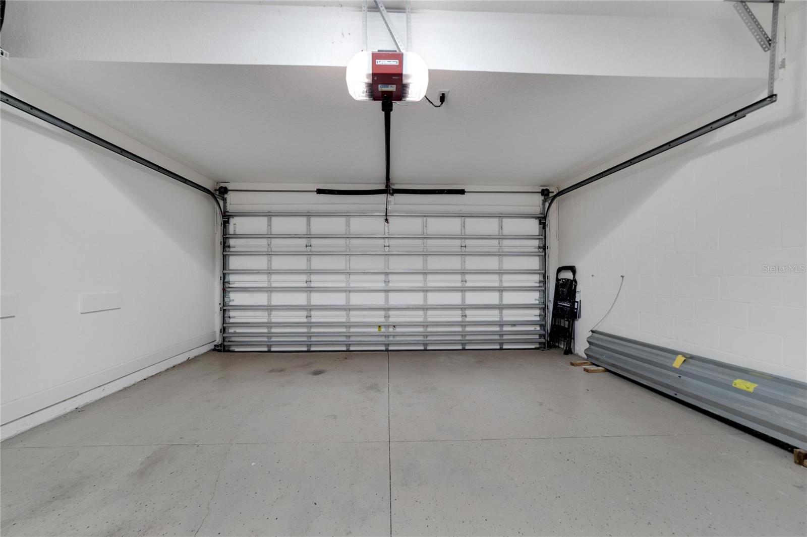 Garage with epoxy floors at 12306 Terracina Chase Ct, Tampa, FL 33625