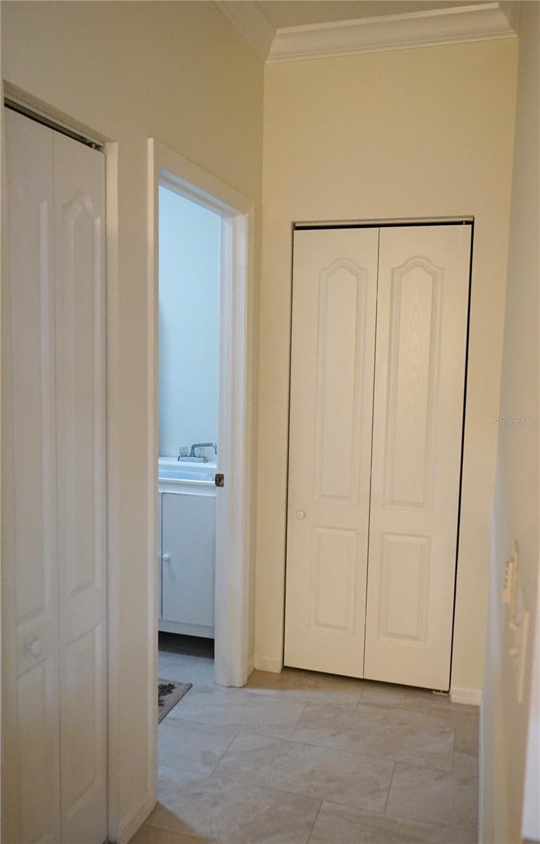 pantry for kitchen and storage closet by laundry room