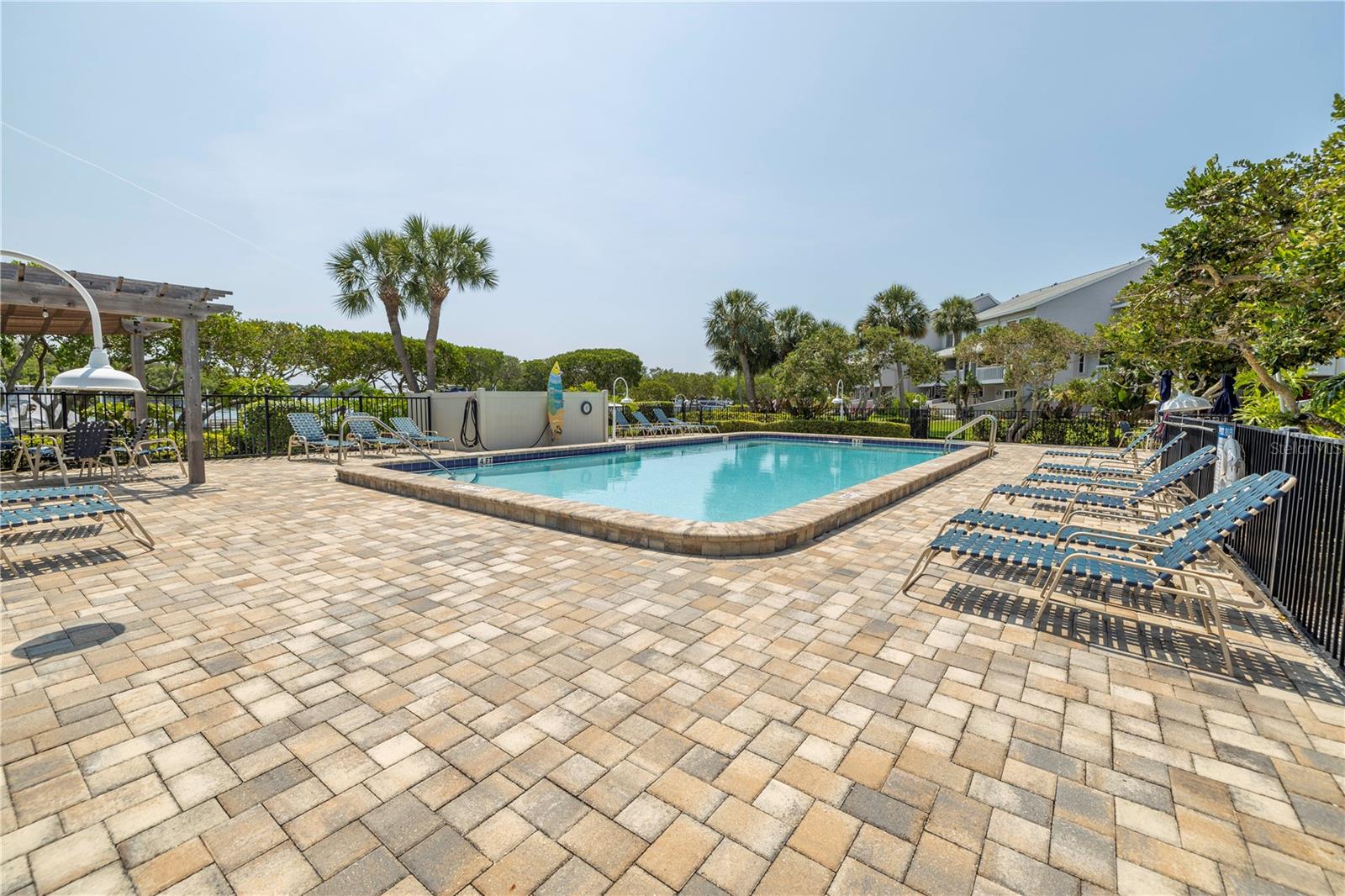 Pool with custom surfboard shower