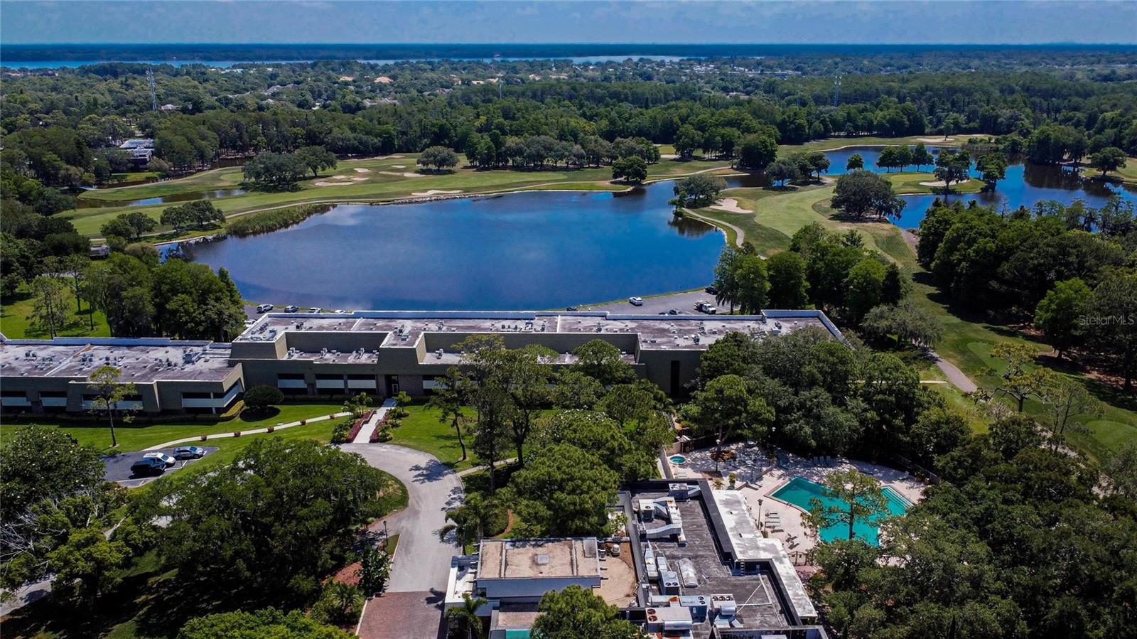 Overlooking Canterbury Building with Island Pool in foreground next to Lake Innisbrook.