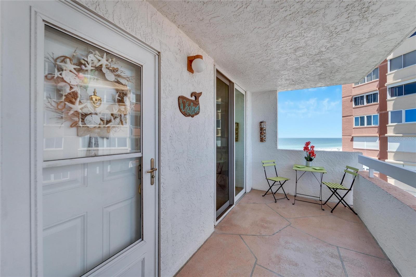 Private front patio facing the intracoastal with views of the Gulf.