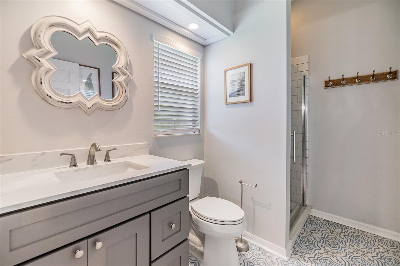 Super cute and updated full downstairs guest bathroom.