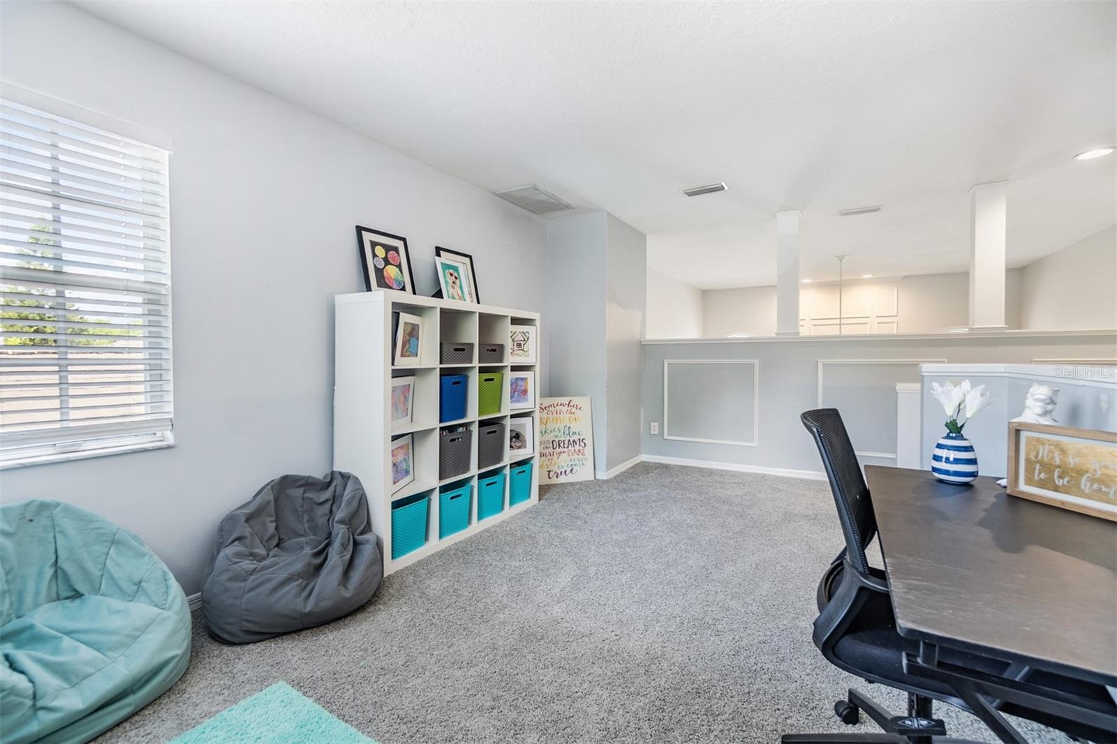 Open Loft Area, New Carpet, Lots of Natural Sunlight, open to the Foyer and Family Room.
