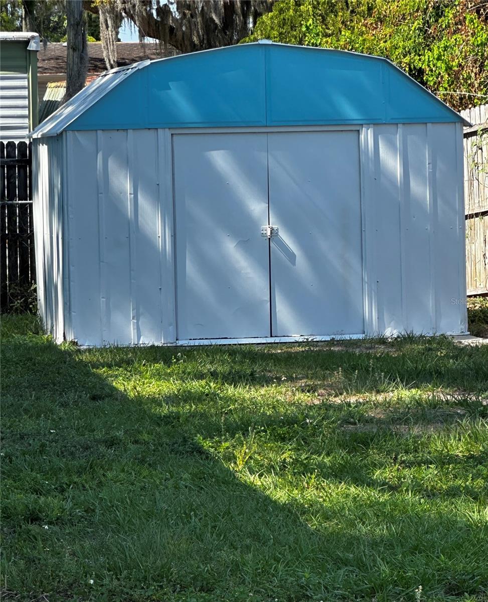 double door shed on concrete