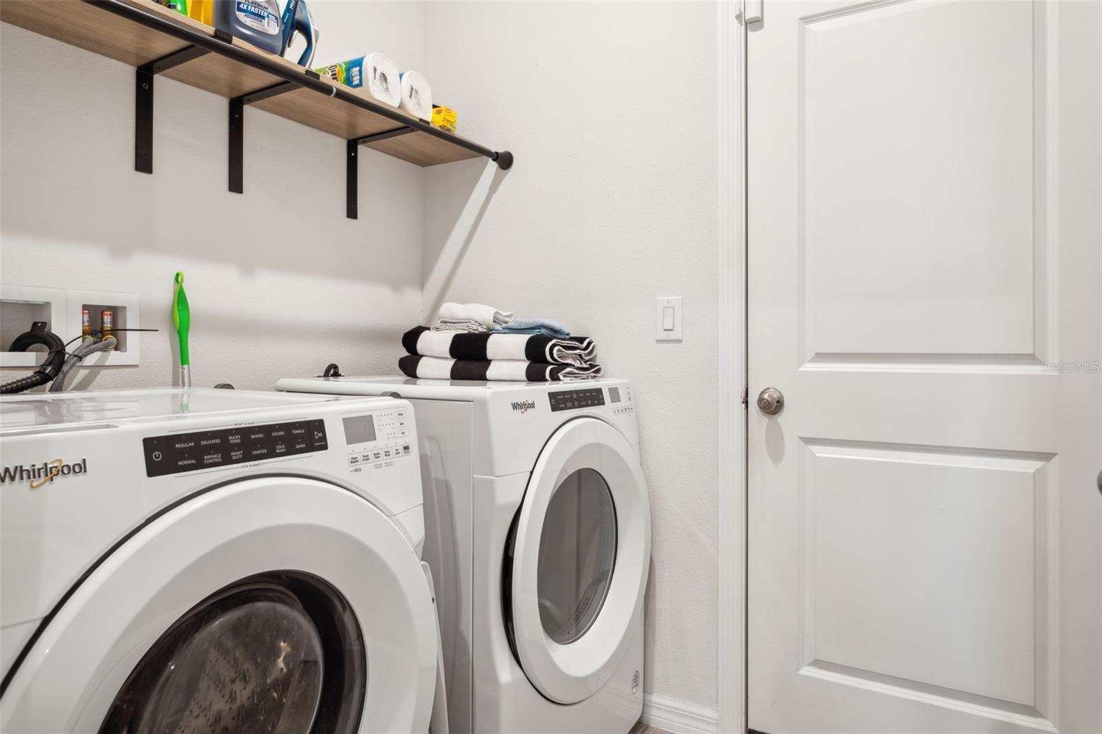 Laundry room is just off the garage and kitchen areas.