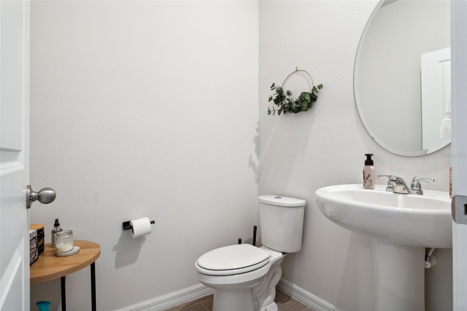 This half bath on the first floor is convenient to guests.
