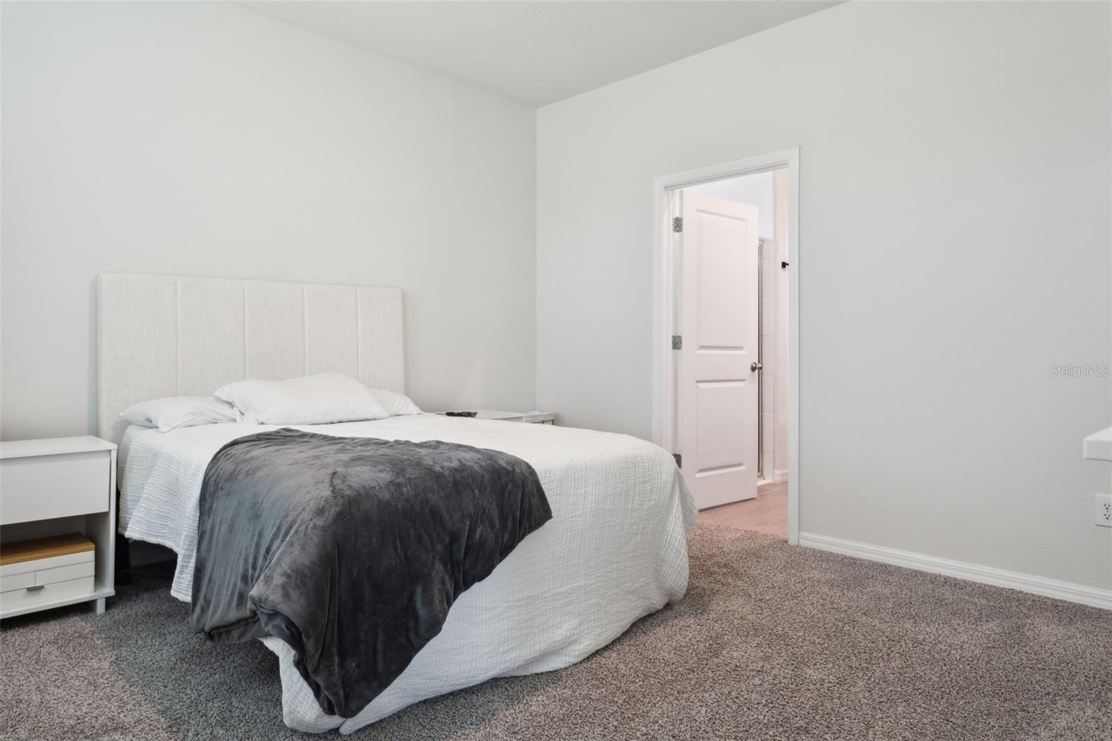 Primary suite is on the first floor with ensuite bath and walk in closet.