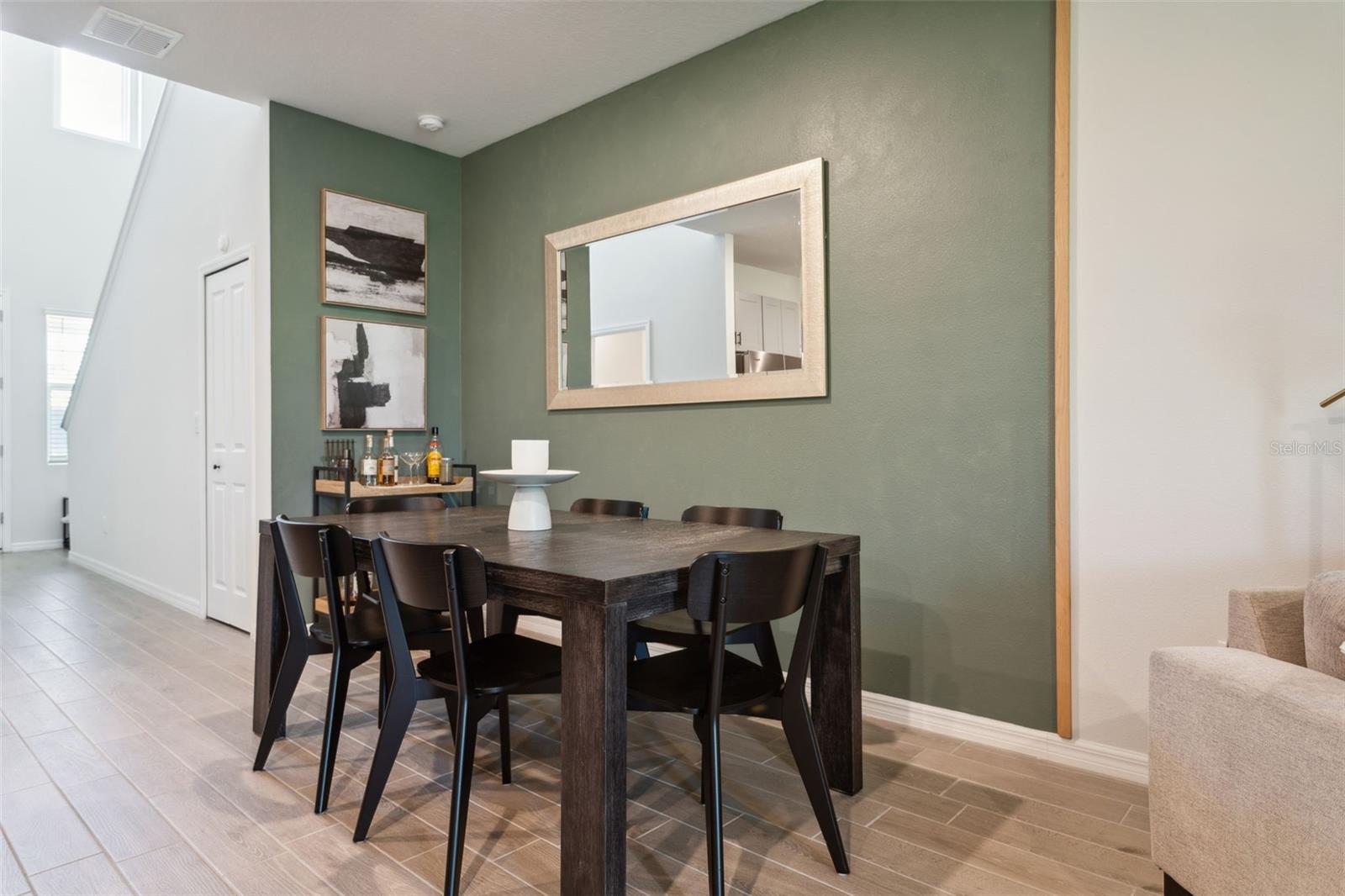 Dining area with accented wall easily seats 6-8.