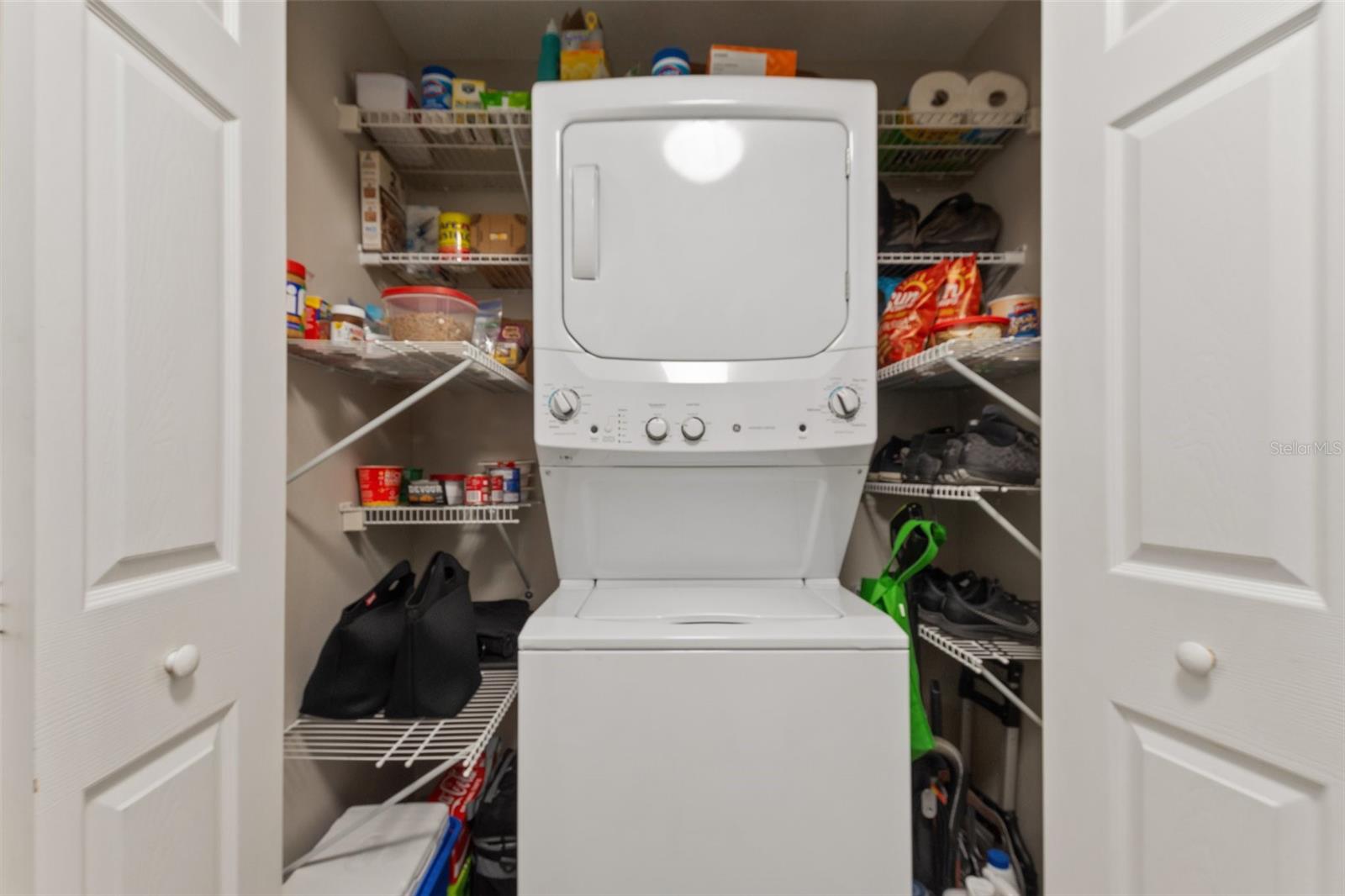 Laundry closet with added storage shelves