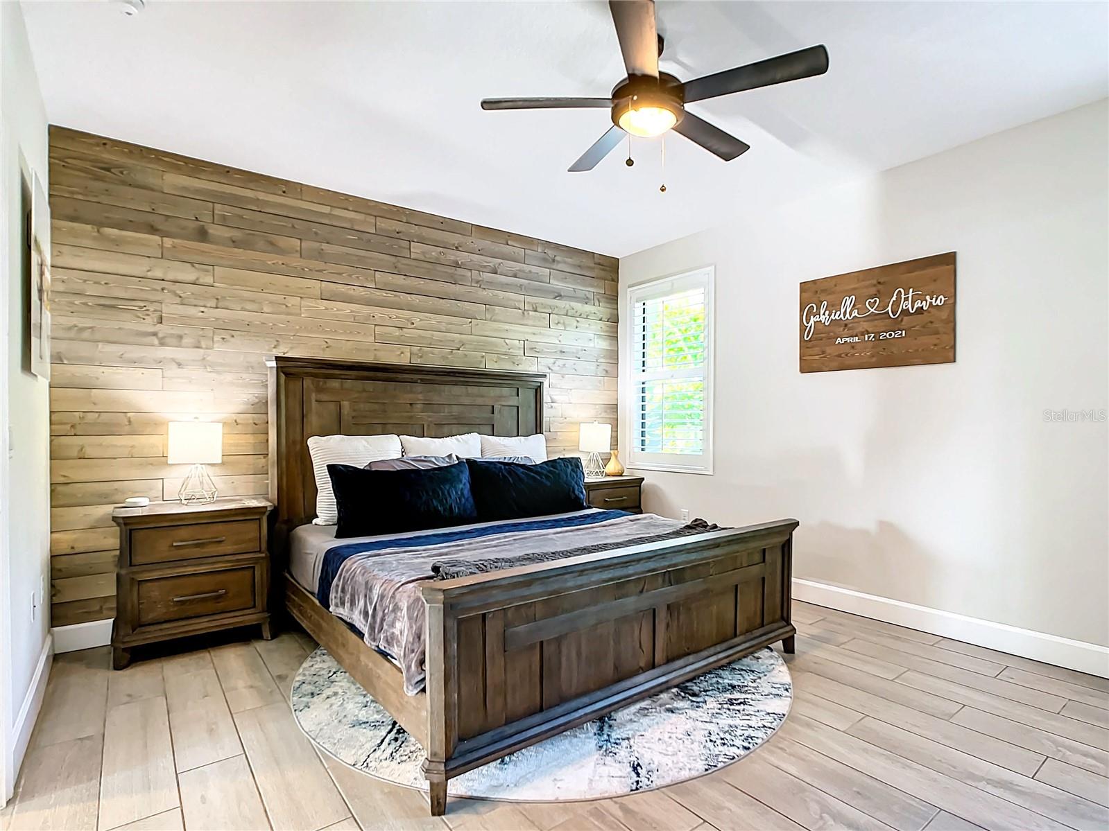 Primary suite with wood feature wall