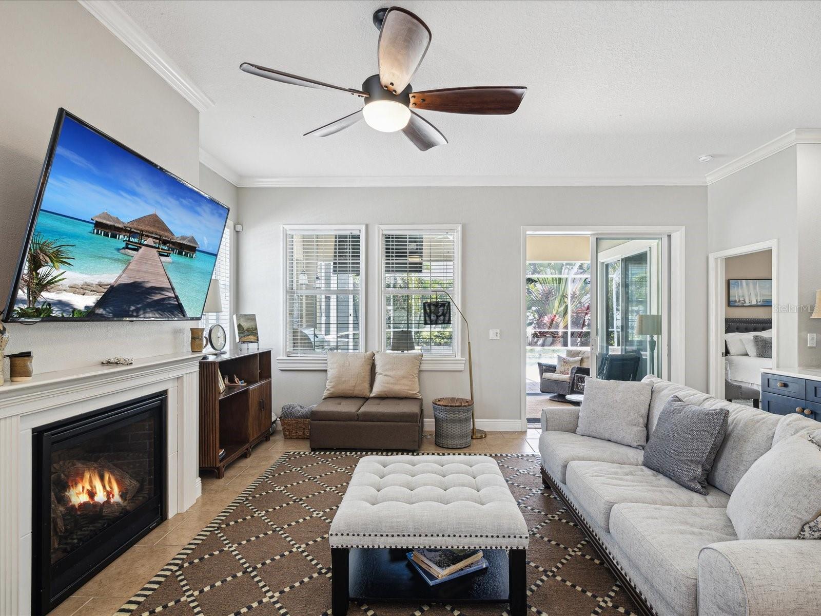 The living area features a working gas fireplace and lots of windows for natural light.