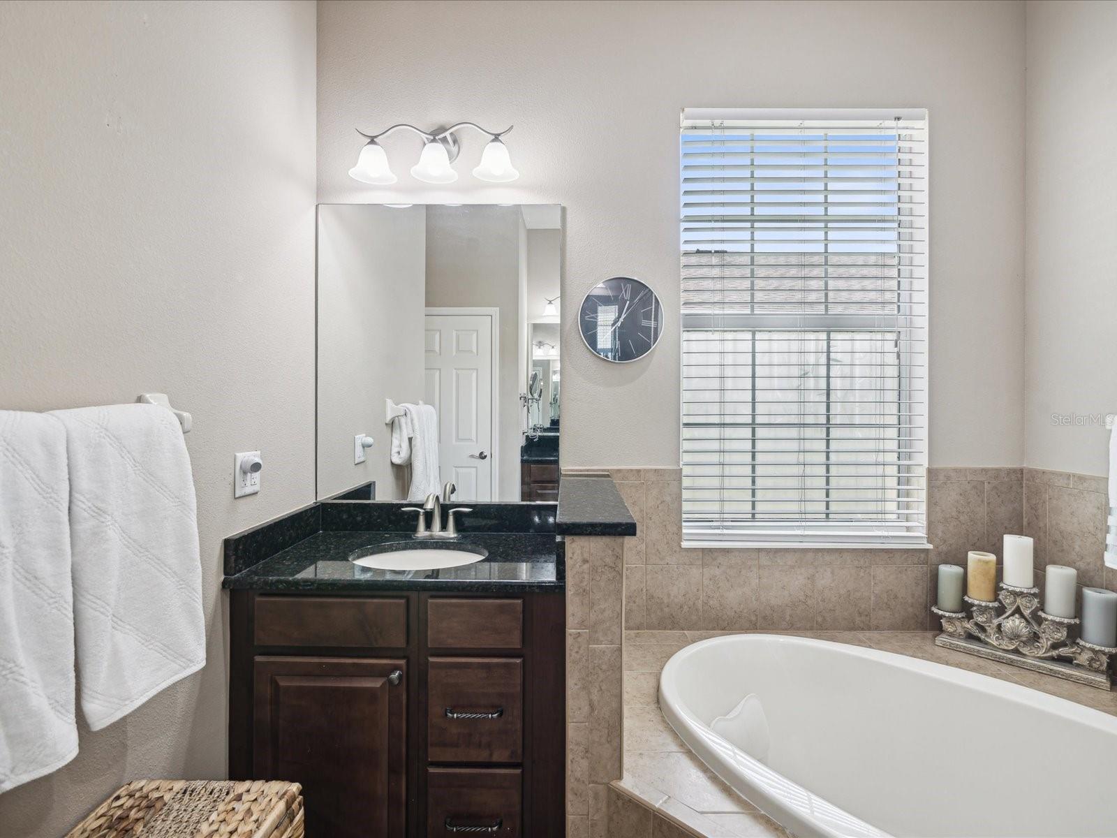 Separate vanities allow for more personal space and extra storage.