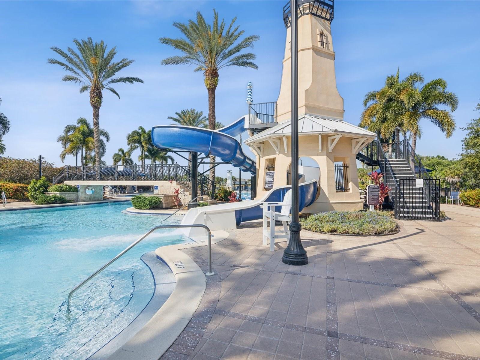 The resort style pool provides various water features to entertain adults and children alike.