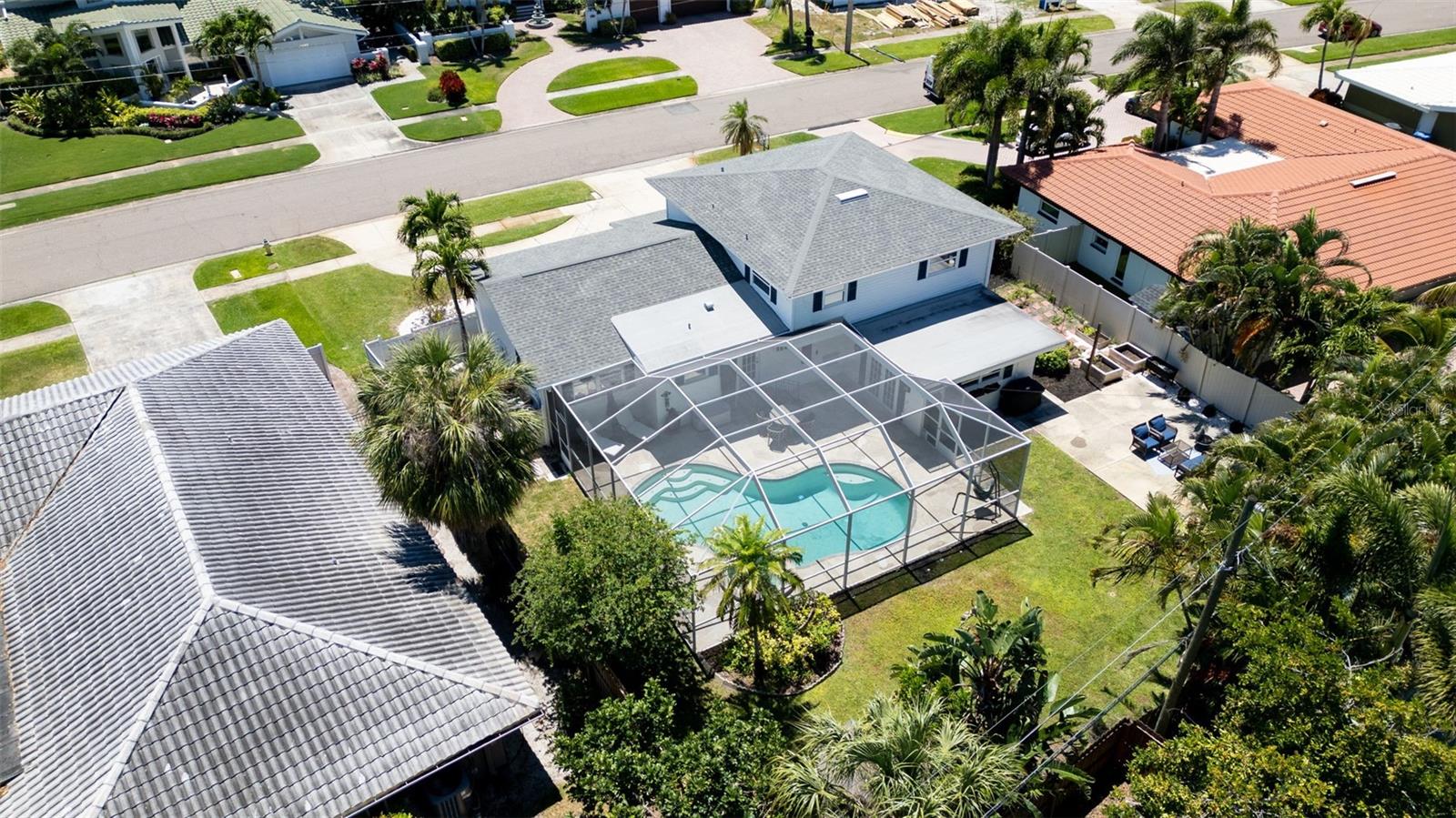Spacious, fully-fenced backyard, including screened-in pool.