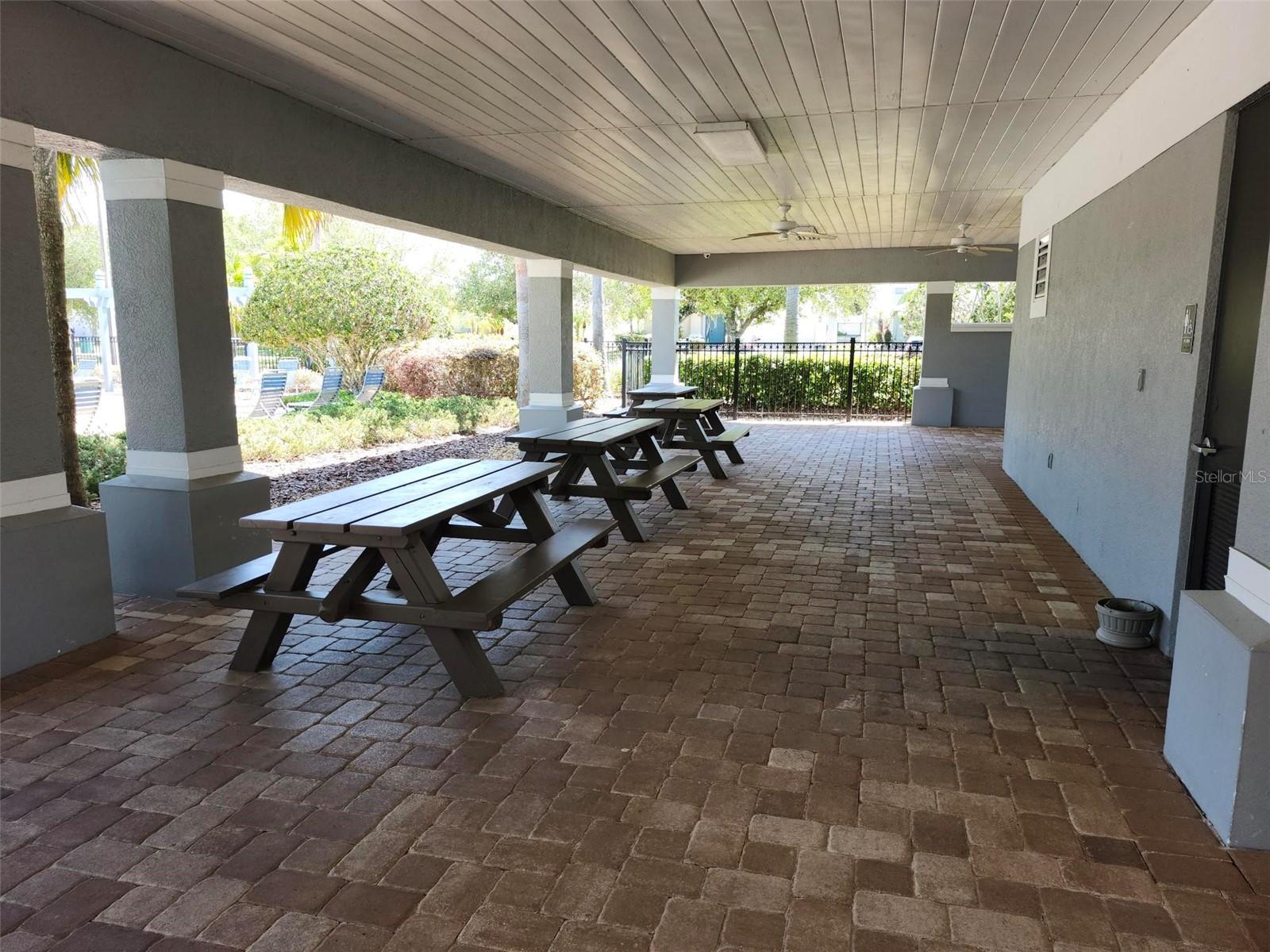 Club house has numerous picnic tables to use for your gatherings