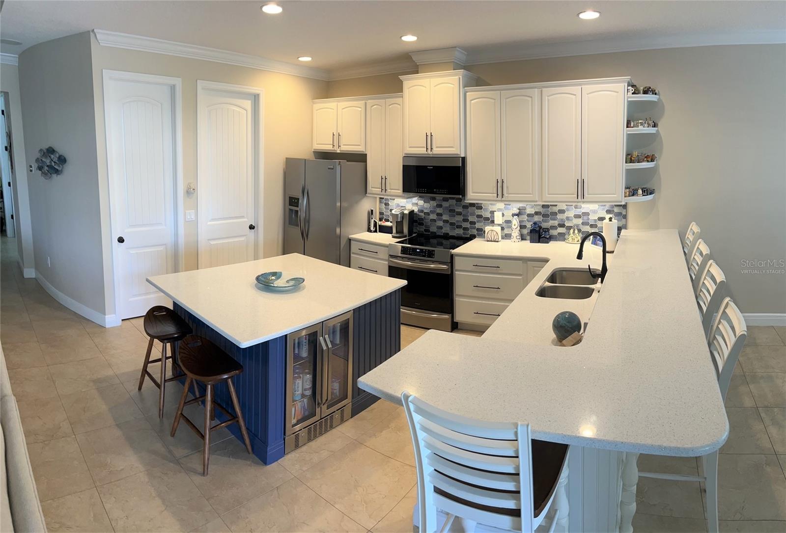 Kitchen - large island with 2 bev refrig-Virtually staged