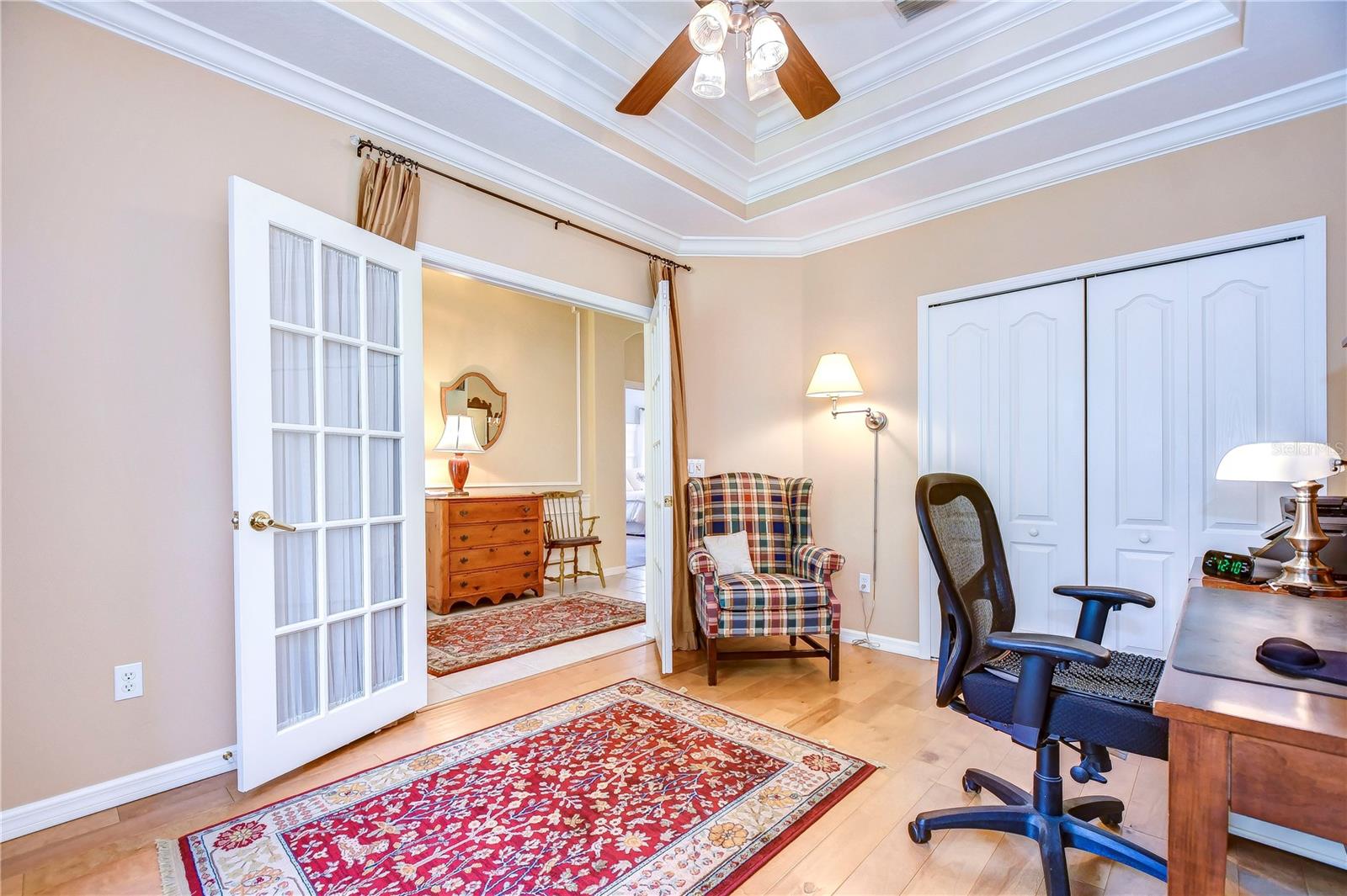 Beautiful tray ceiling and French doors!
