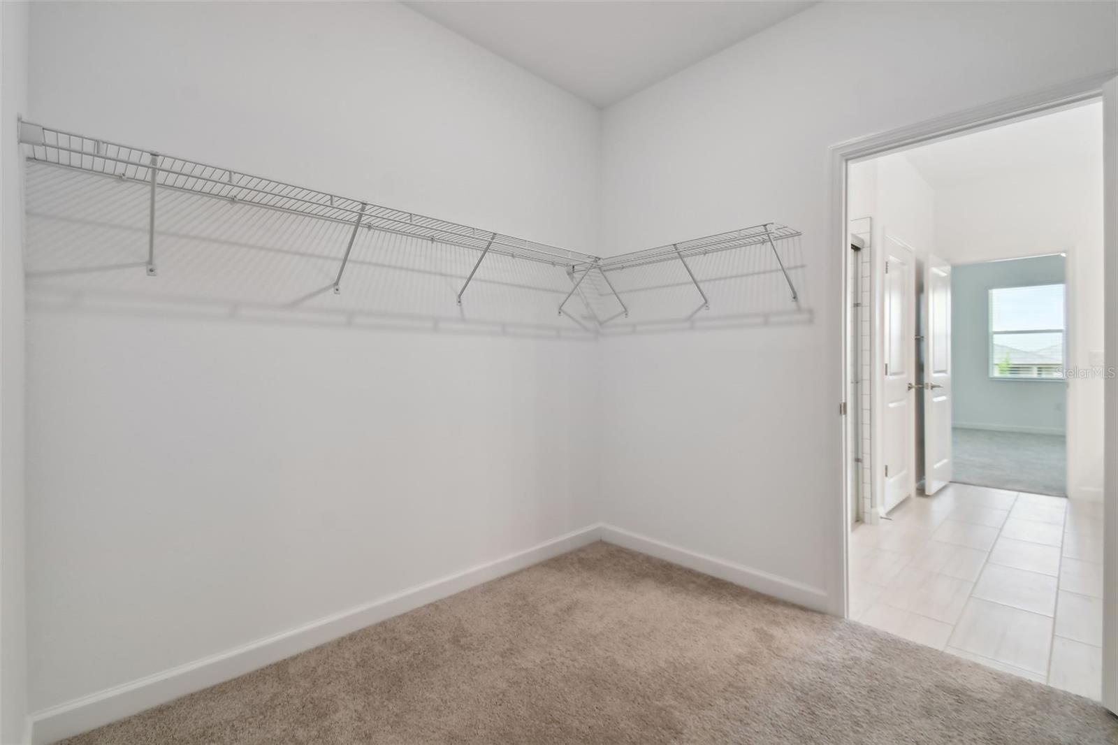 very large walk-in primary closet