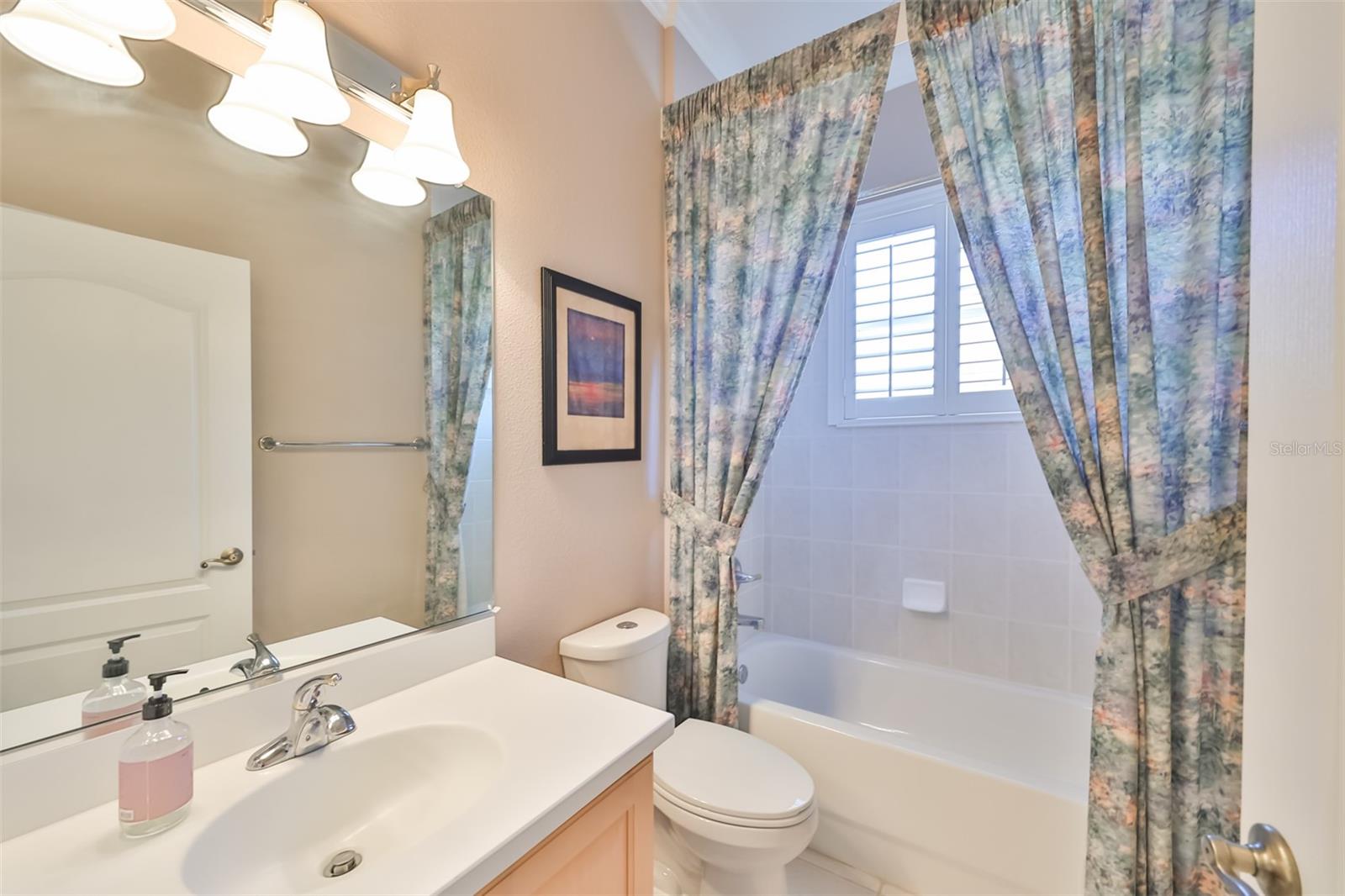 7. Guest Bathroom with plantation shutters