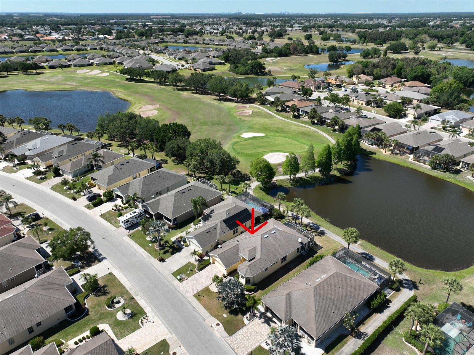 12.1 Ariel view of community, with home outlined in red arrow