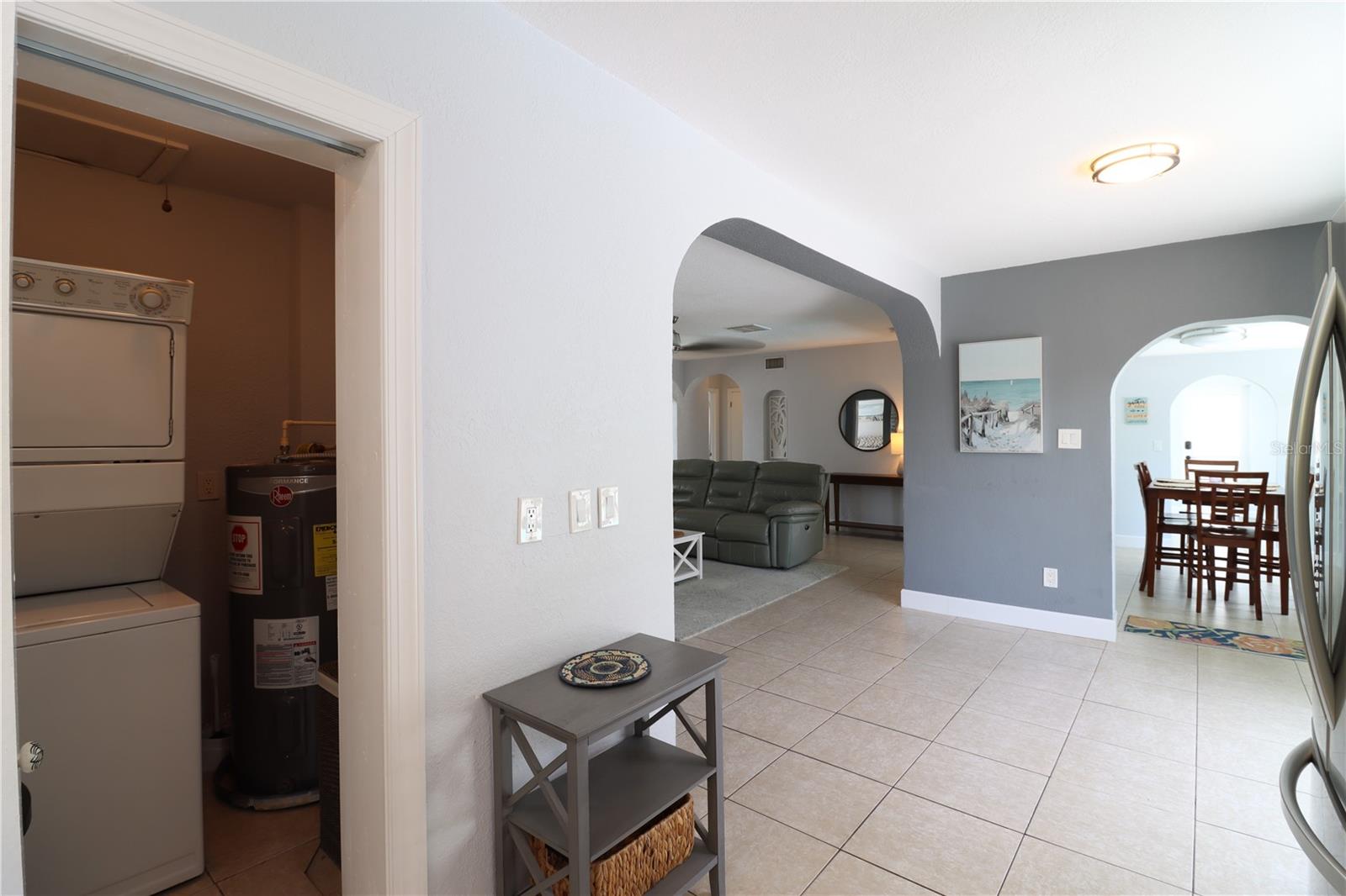 Laundry closet just off the kitchen.  Look at those arch-ways!