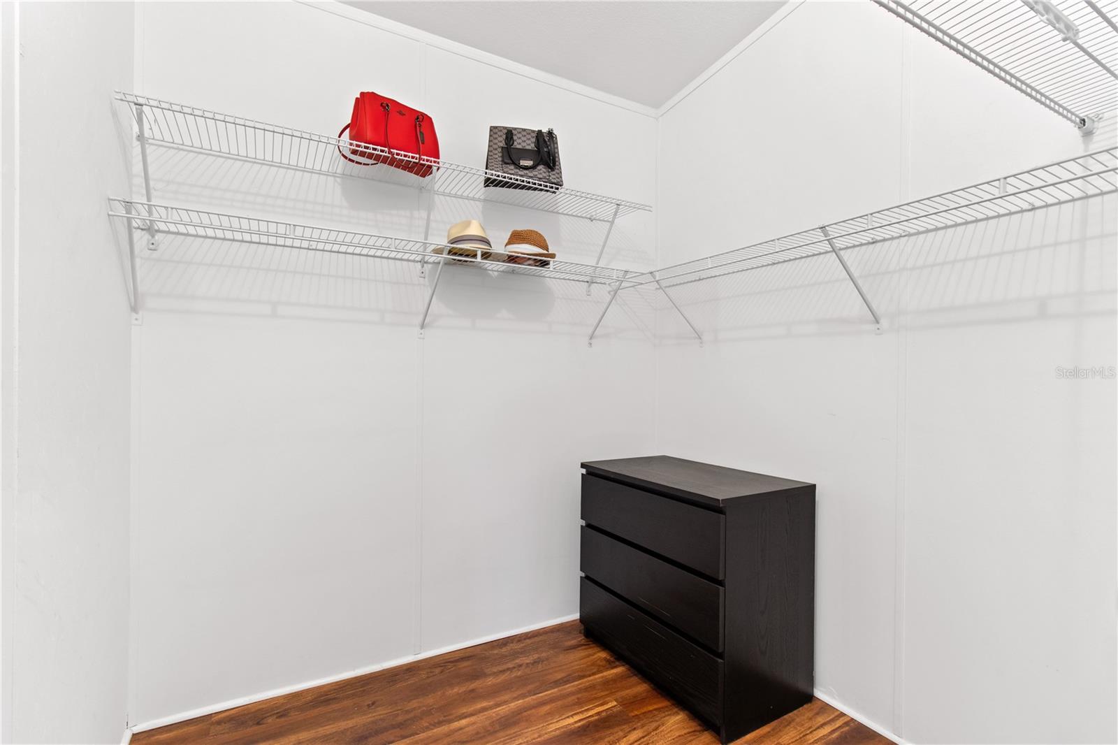 Two walk-in closets in primary bedroom