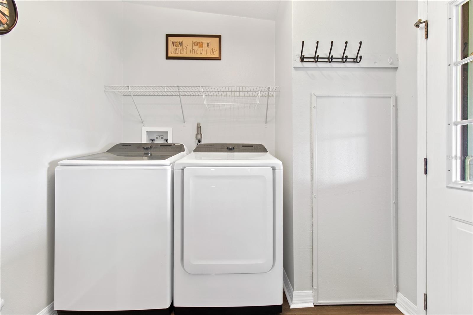 Utility room off kitchen is indoor laundry room. Washer & Dryer convey.